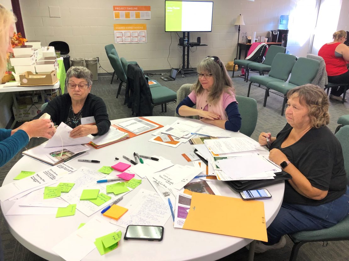 Three women sitting at table